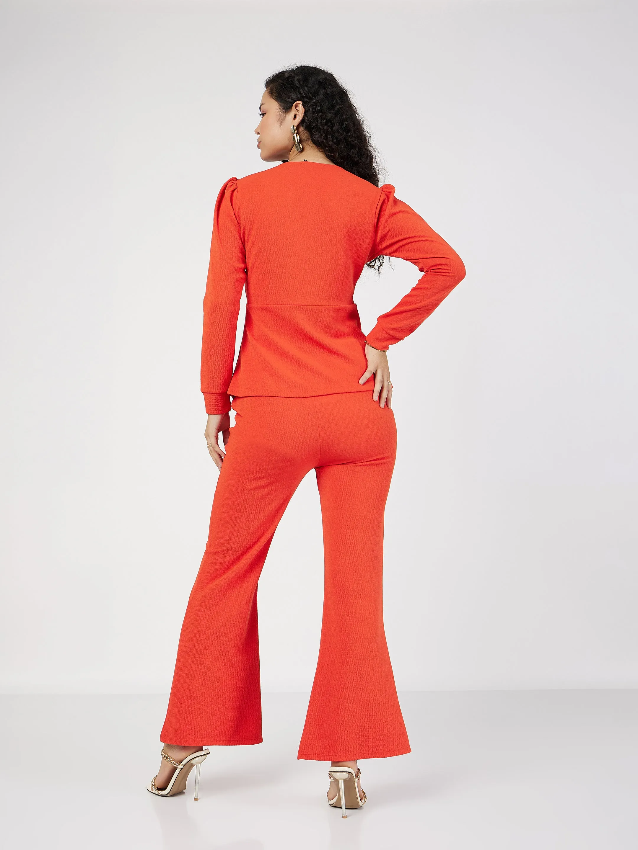 Women Orange Wrap Peplum Top With Bellbottom Pants