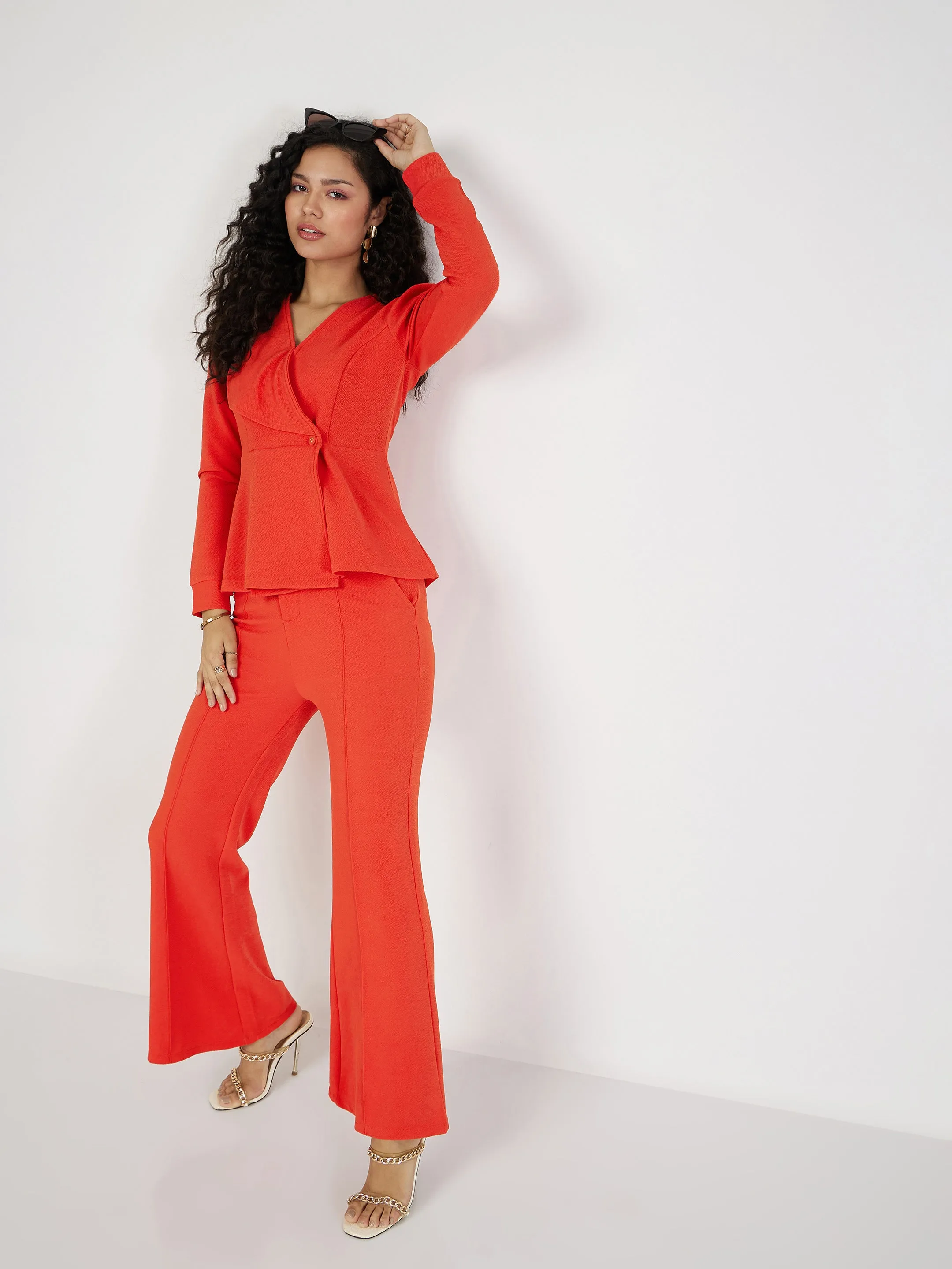 Women Orange Wrap Peplum Top With Bellbottom Pants